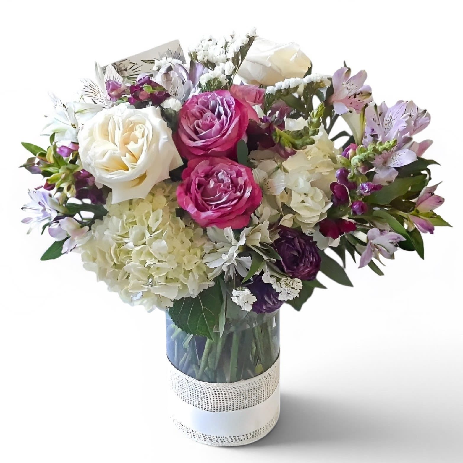 With Deepest Sympathies Designer's Choice - Roses hydrangeas and more arranged in a modern tall glass cylinder vase wrapped in vanilla jute ribbon. Beautiful and perfect to send to show them how much you care. Always made unique and extra special each and every time. Please visit my beautiful gallery. Send them you condolences today.