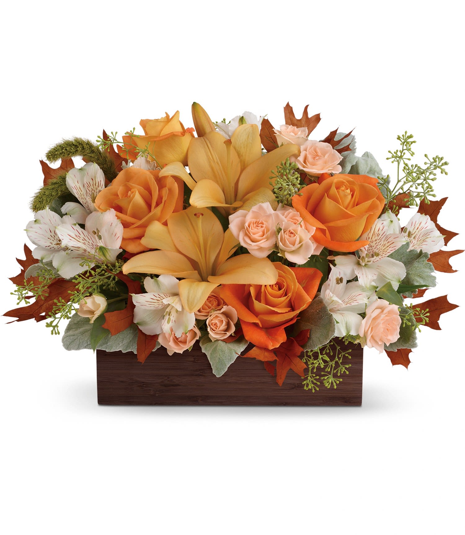 Teleflora's Fall Chic Bouquet - This impressive centerpiece arrangement features light orange and peach roses, peach asiatic lilies and white alstroemeria, and finished with dusty miller, seeded eucalyptus and millet. Delivered in a Dark Bamboo Rectangle. Approximately 18" W x 11 3/4" H
