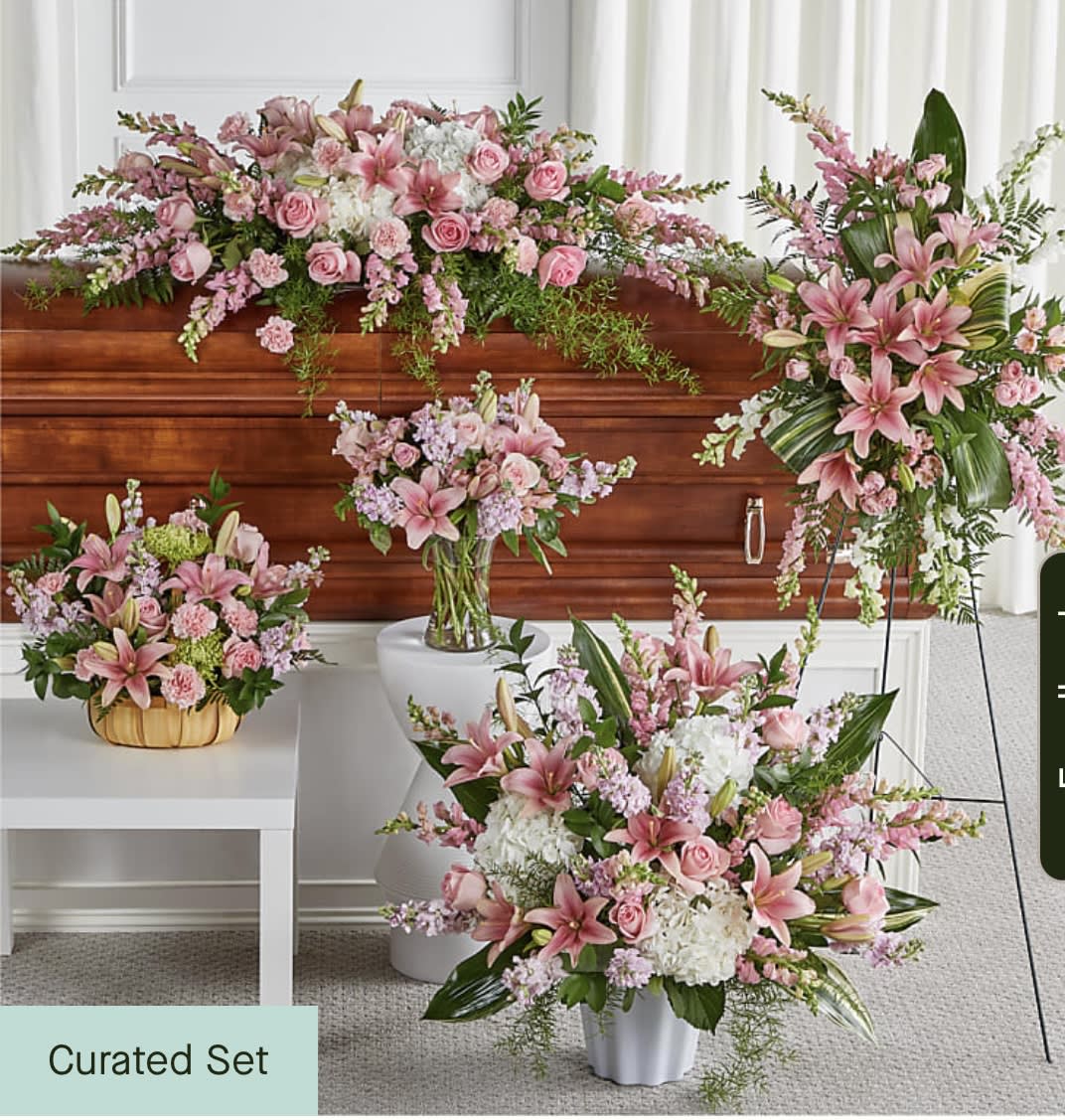 Pink floral funeral set with lilies, roses, and carnations in multiple arrangements