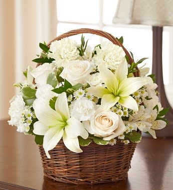 Peace, Prayers, &amp; Blessings- All White - Product ID: 95383   Make a heartfelt gesture of your sympathy with our classic all-white basket arrangement of roses, lilies, alstroemeria, carnations and monte casino. Hand-gathered into a lovely willow handled basket, itâs a simple yet touching way to offer peace and comfort during their time of sorrow. Hand-gathered basket arrangement of white roses, lilies, alstroemeria, carnations, mini carnations, and monte casino, accented with variegated pittosporum Designed in a willow handled basket; measures 8"H Appropriate to send to the home of friends and family members or to the memorial service Large arrangement measures approximately 12"H x 12"L Medium arrangement measures approximately 11"H x 11"L Small arrangement measures approximately 10"H X 10"L Our florists hand-design each arrangement, so colors, varieties, and basket may vary due to local availability