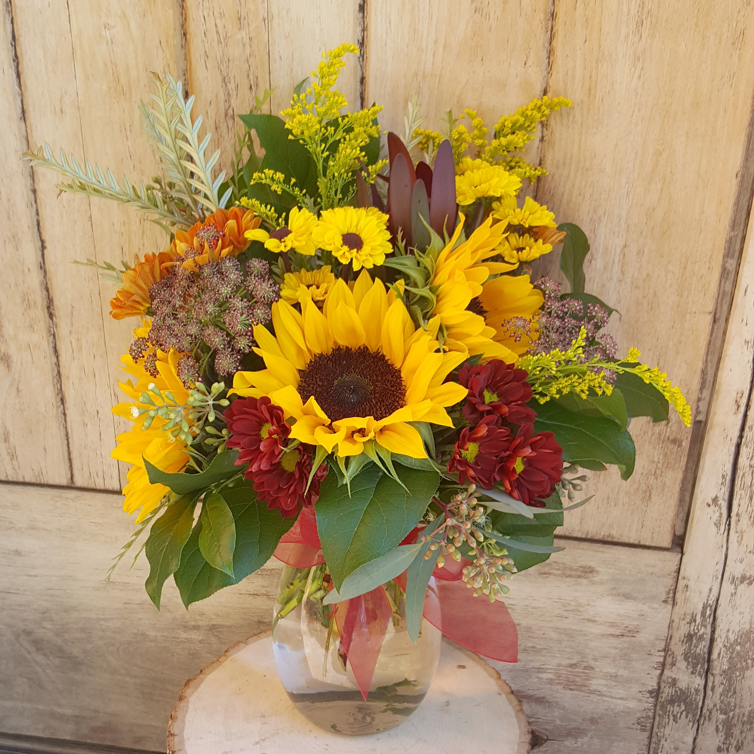 Fall vase - Classic design of fall toned Daisy's and sunflowers. Measures approx 14" tall. 