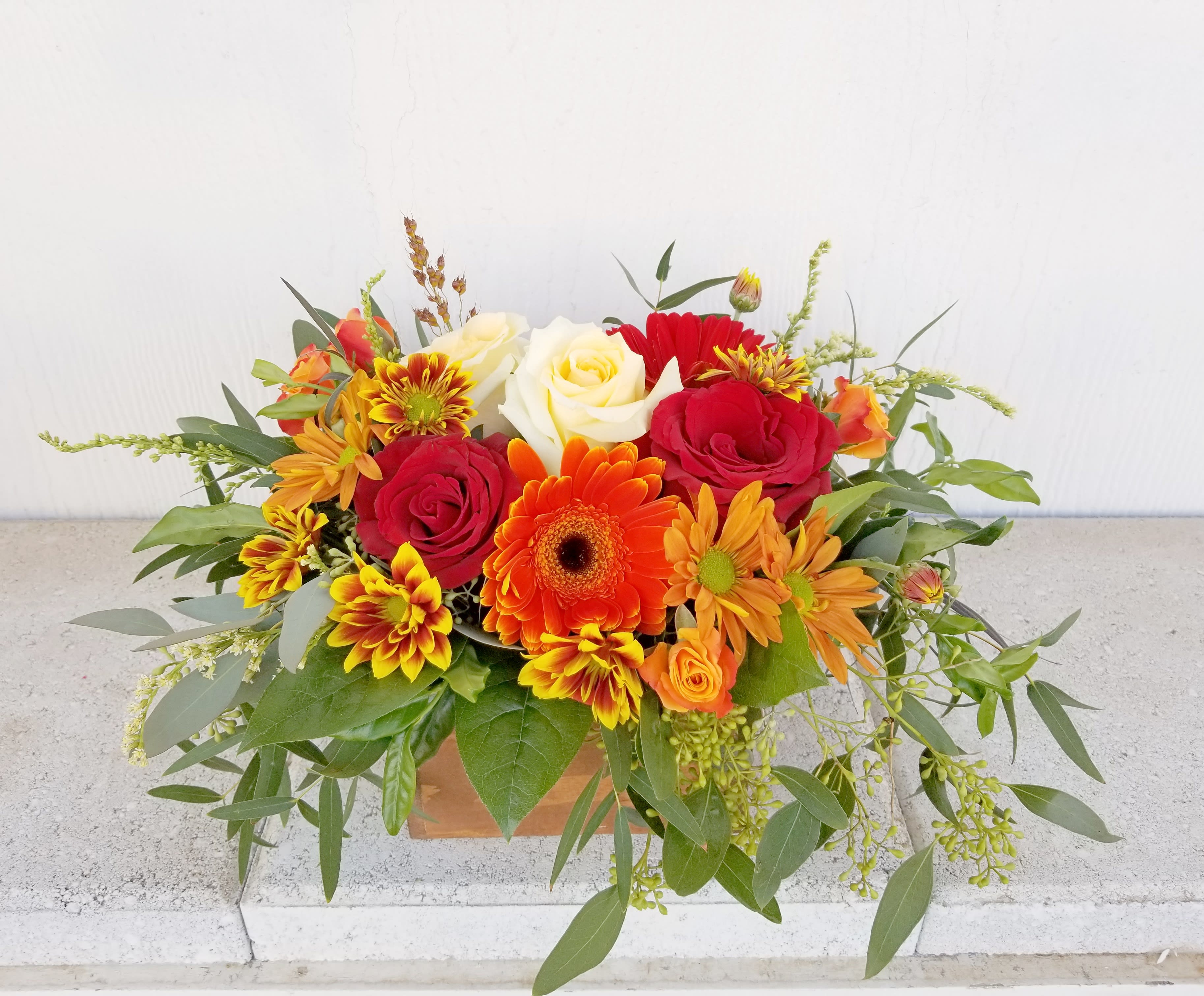 PV Fall Box Arrangement  - Measures approx 12" wide. Upgrade to deluxe add more flowers to the same size box for a fuller look.  Premium is in bigger box and has more flowers 