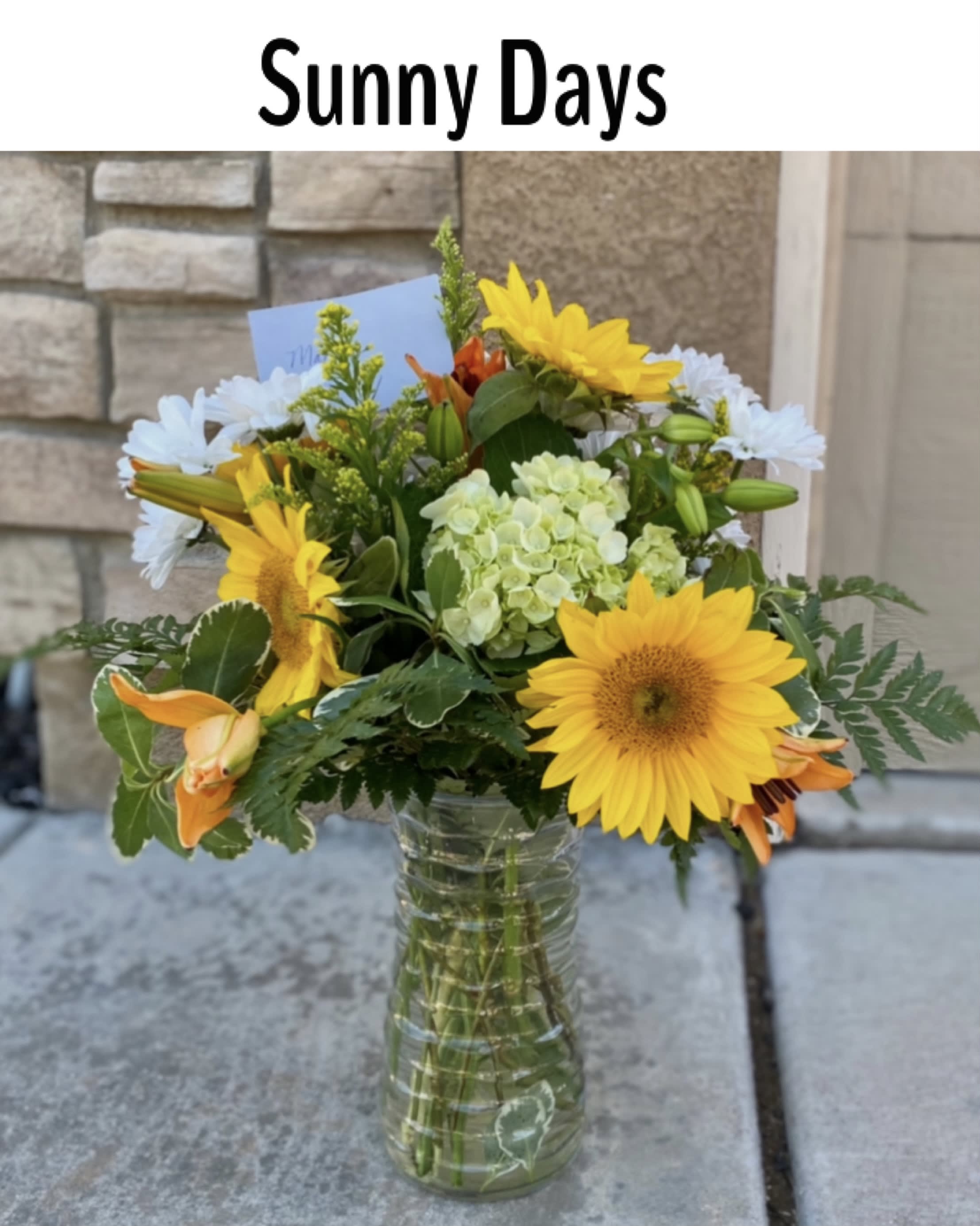 Sunny Days - The sun is pretty great, but sunflowers are the greatest. Let’s prove it. The sun keeps us warm, we’ll admit it, but sunflowers never make us sweat. The sun gives us the daytime, which we appreciate, but sunflowers don’t go away for 12 hours per day day. Sunflowers, unlike the sun, know that would be rude. Finally, the sun gives us a nice tan once in awhile, but sunflowers have never given anyone a sunburn. Send our Sunny Days arrangement to brighten someone’s day!
