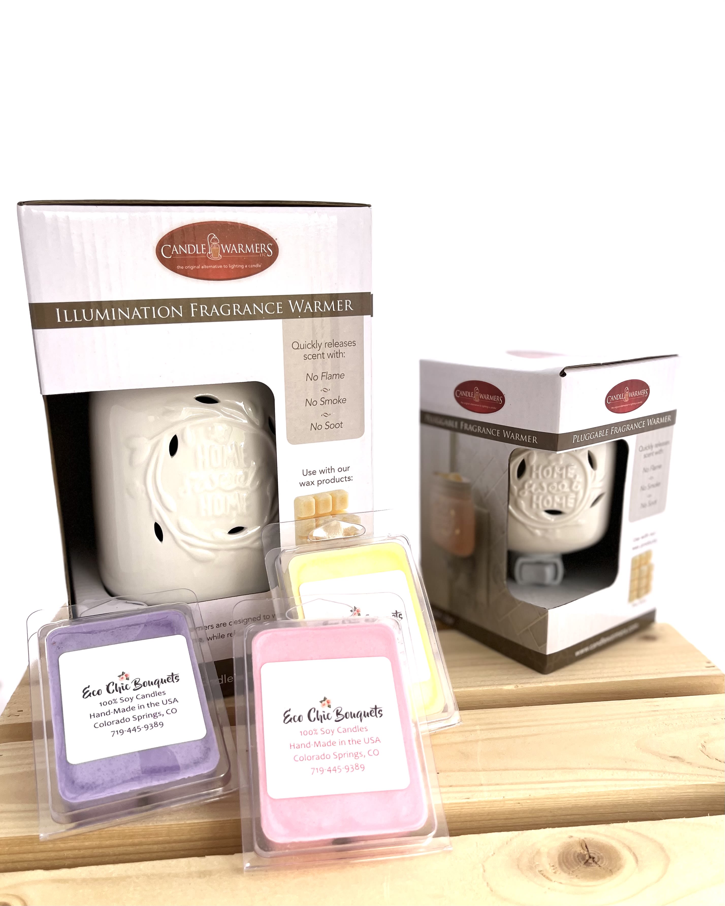 Packaged candle warmers and wax melts on a wooden surface