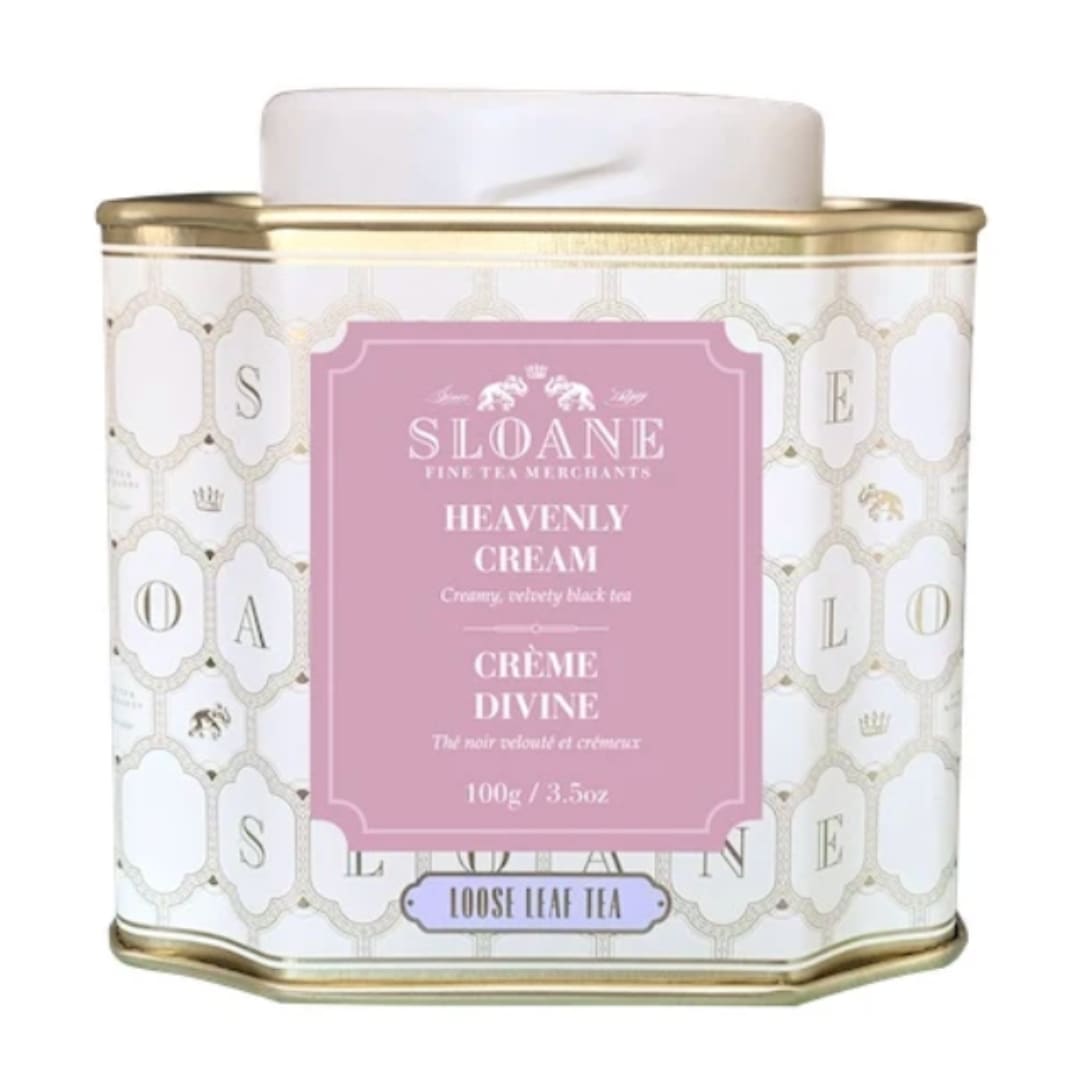 Decorative tin of loose leaf tea with a pink label and gold trim
