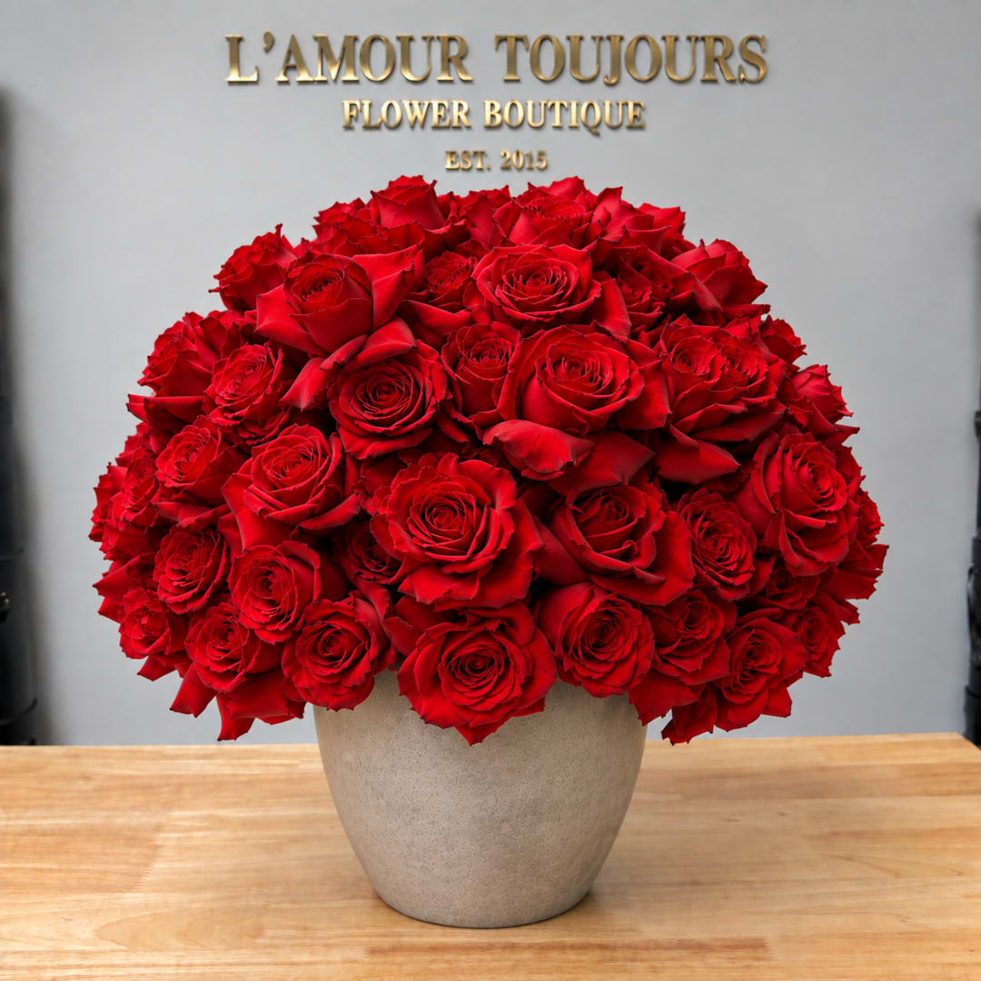 Large bouquet of red roses in a beige vase
