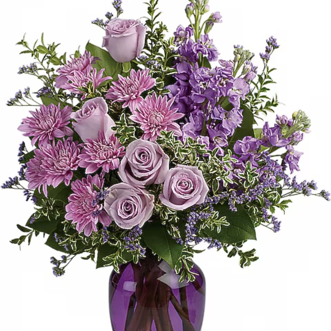 Lavender roses and purple flowers arranged in a vase