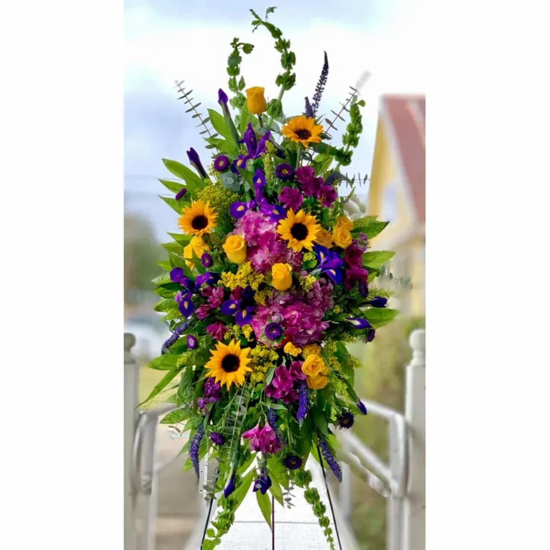 Tall bouquet with sunflowers, purple blooms, and yellow roses