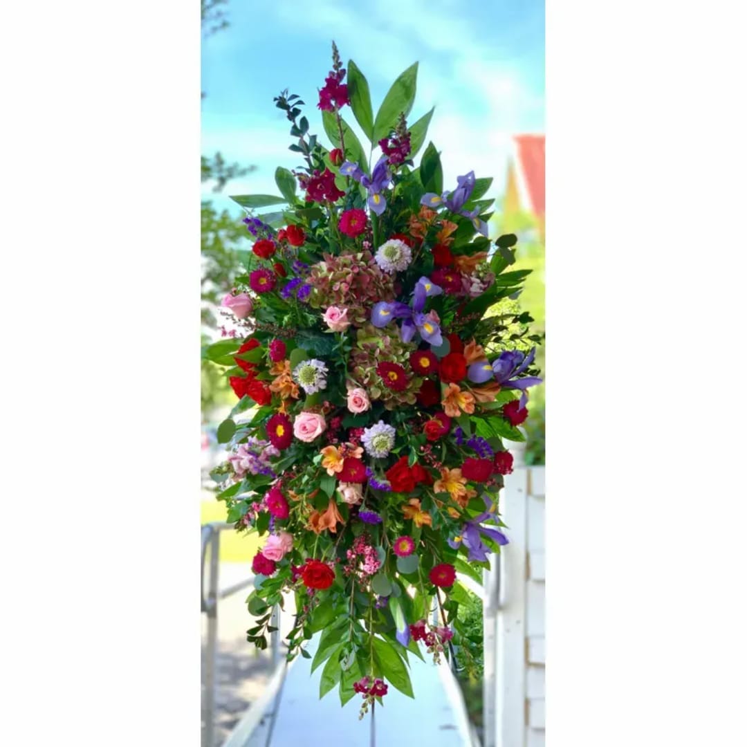 Tall mixed bouquet with purple, red, pink, and orange flowers