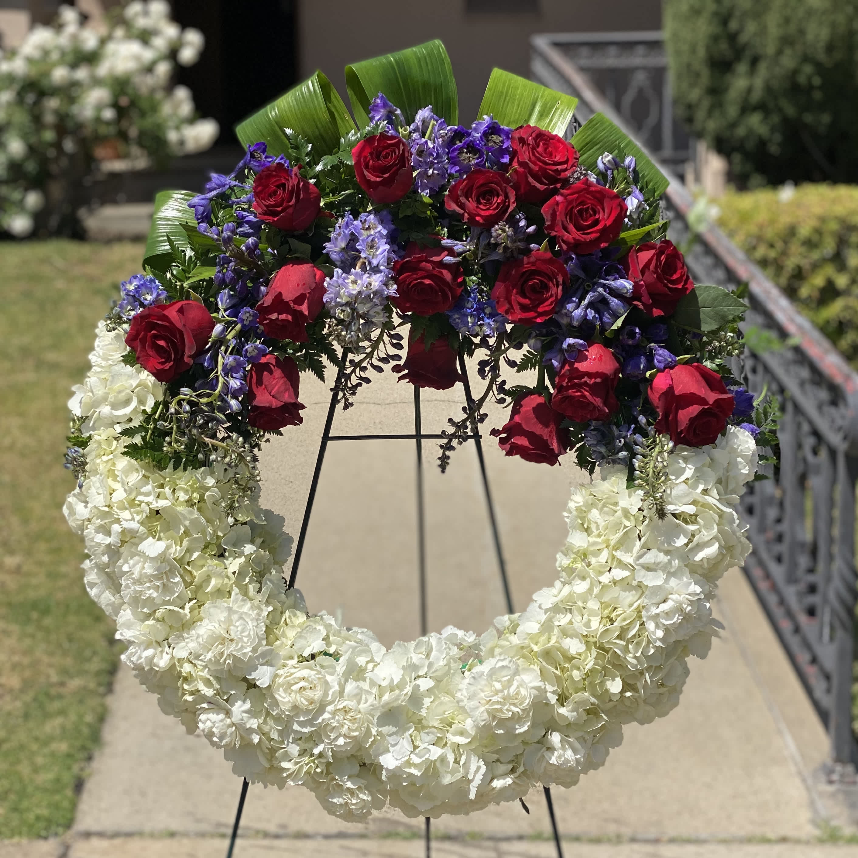American Soul Bouquet - A perfect way to honor your loved one who dedicated their lives serving the people and country. To them whose belief and aspirations are unselfish and heroic. In memoriam for being the best person our community should remember in more years to come.  Approximately 21" D 