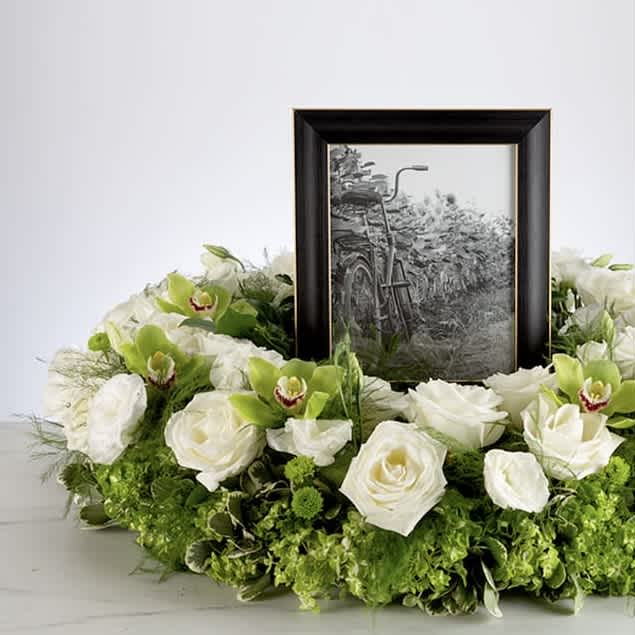 Beautiful Memories  - A beautiful tribute piece and a way to frame a wonderful memory. Honor the memories by surrounding them in blooms.  Approximately 16" D  Frame not included. 