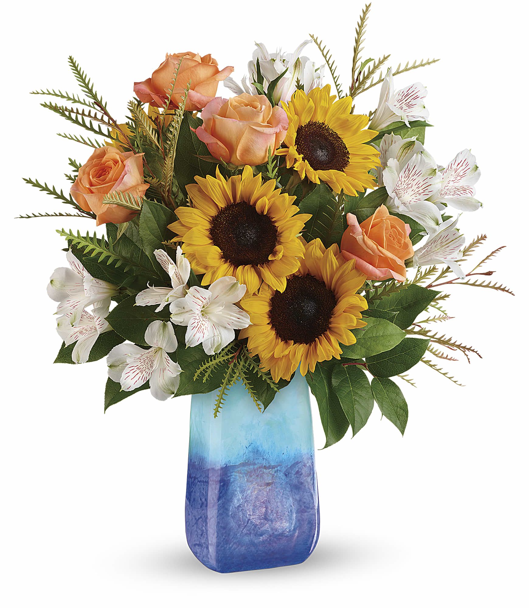 Sunflowers, peach roses, and white alstroemeria in a blue vase