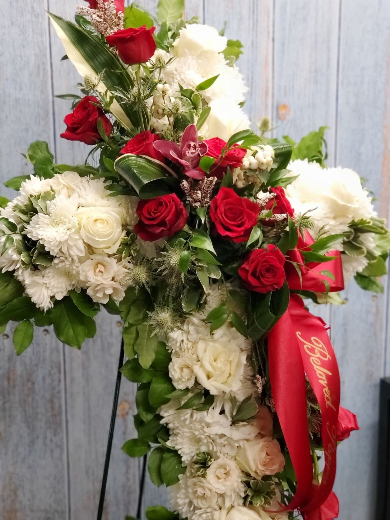 Standing floral spray with red and white roses and chrysanthemums