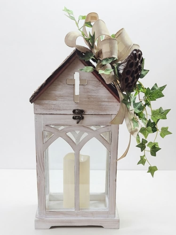 Wooden lantern with a candle and ivy ribbon decoration