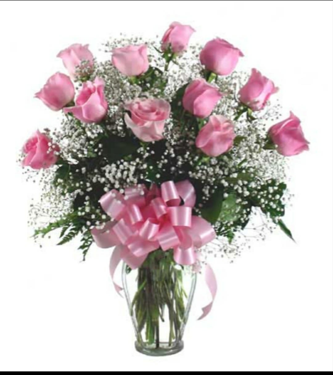 Pink roses in a clear glass vase with a pink ribbon bow