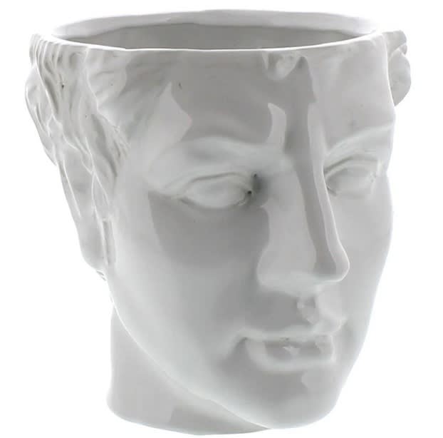 White ceramic planter shaped like a human face