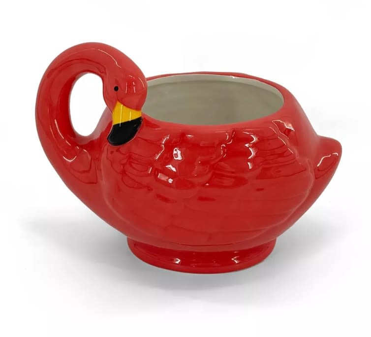 Red flamingo-shaped ceramic planter with an open top