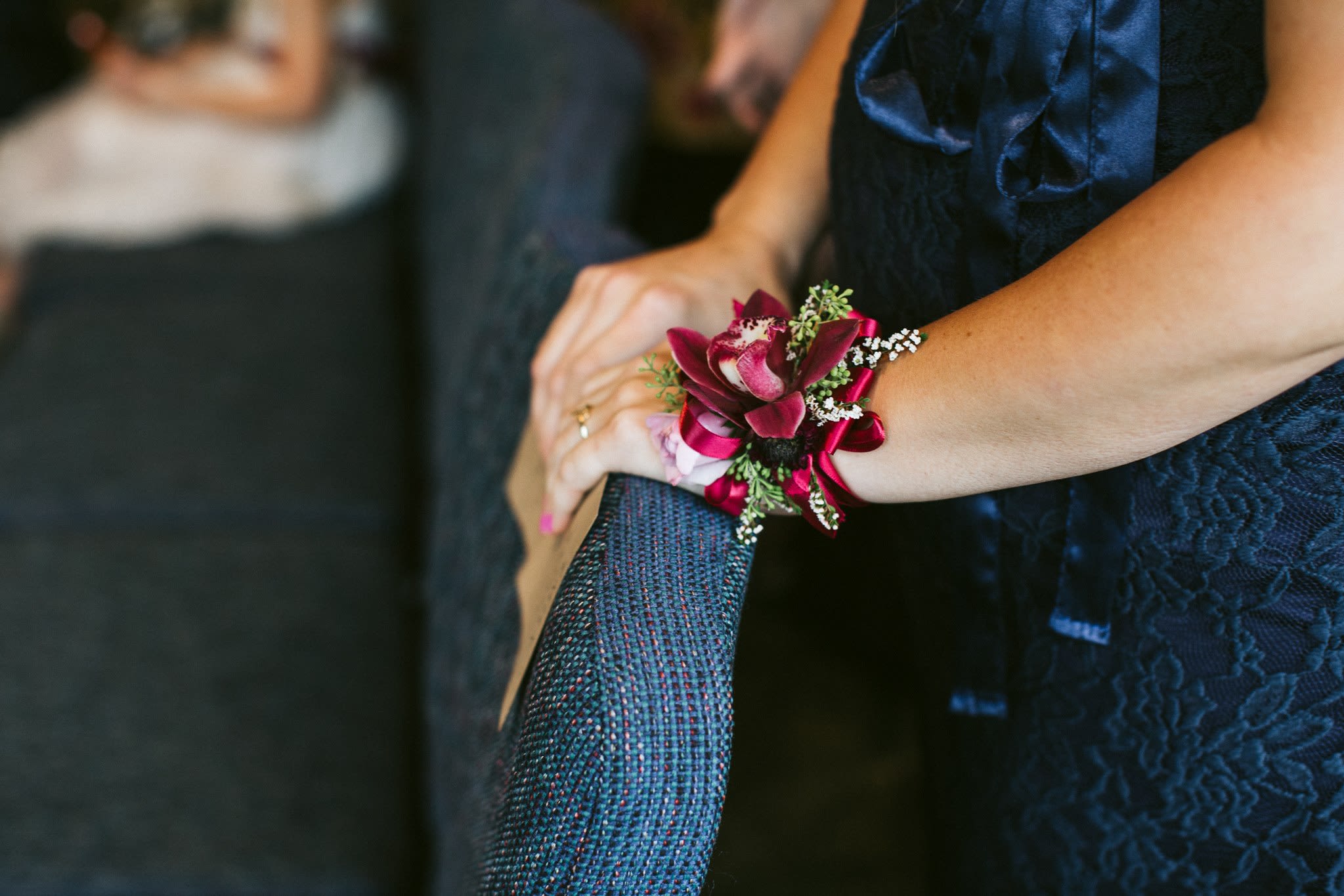 Ribbon Tie on Corsage - A simple corsage designed to tie on the wrist using flowers to coordinate with the wedding.