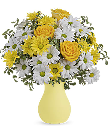 Yellow roses and white daisies in a yellow vase