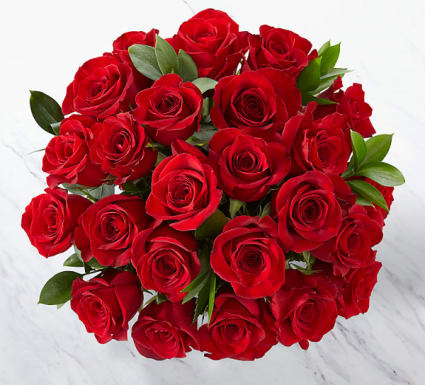 Bouquet of red roses with green leaves