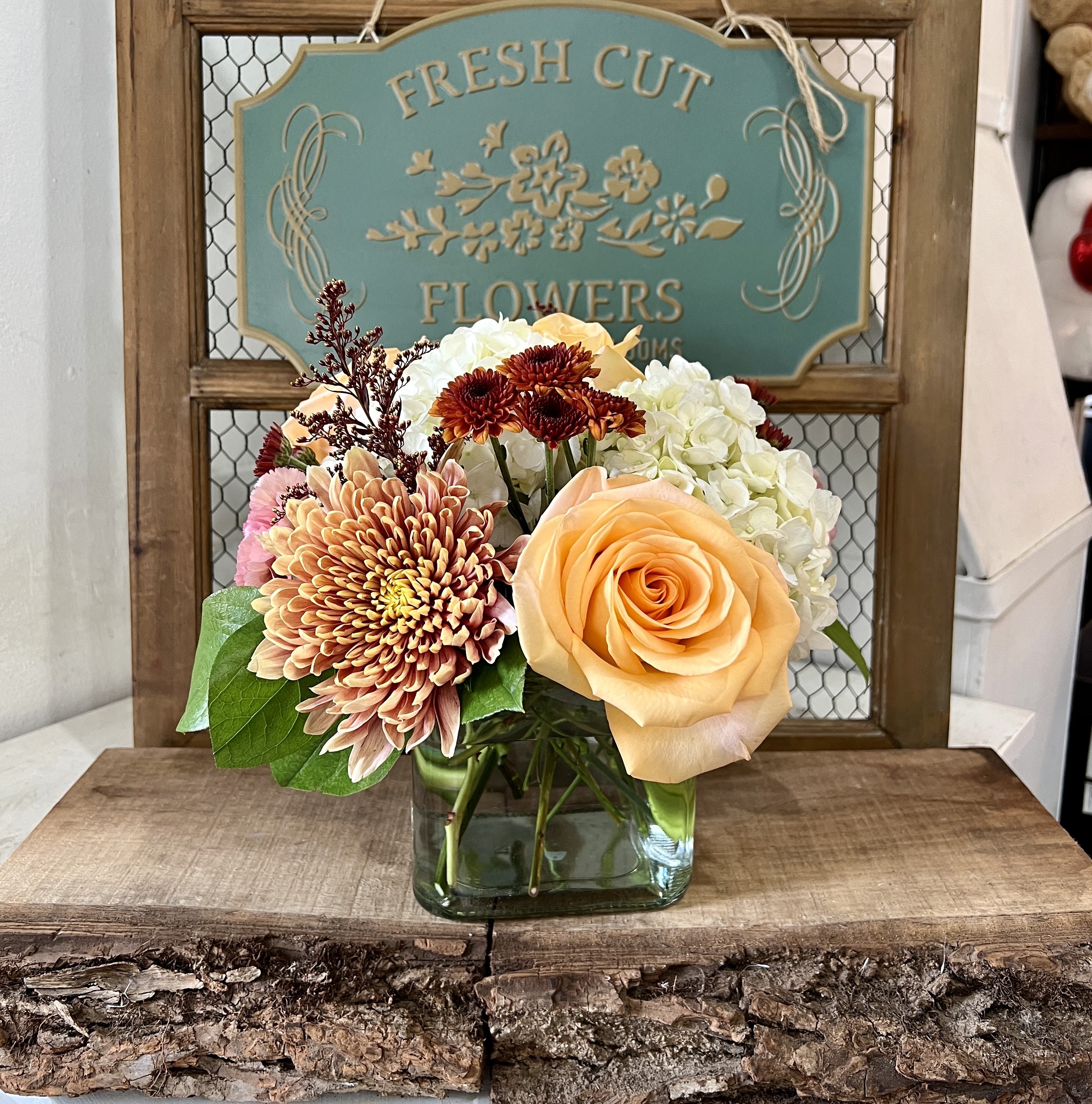 Sunset - Just sit back and enjoy all the beautiful autumn colors this arrangement brings to your place. 