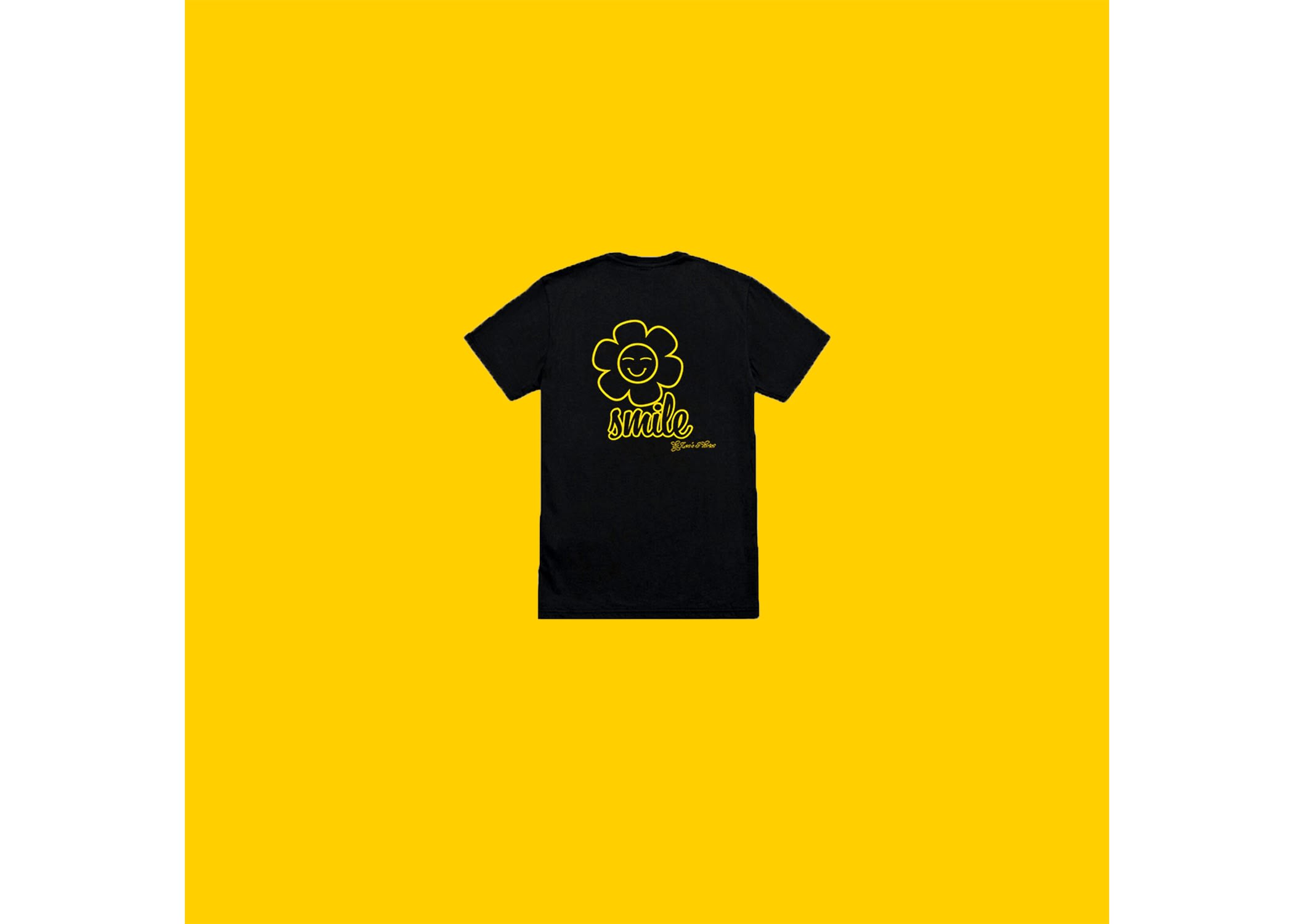 Black T-shirt with a yellow smiley flower graphic on a yellow background