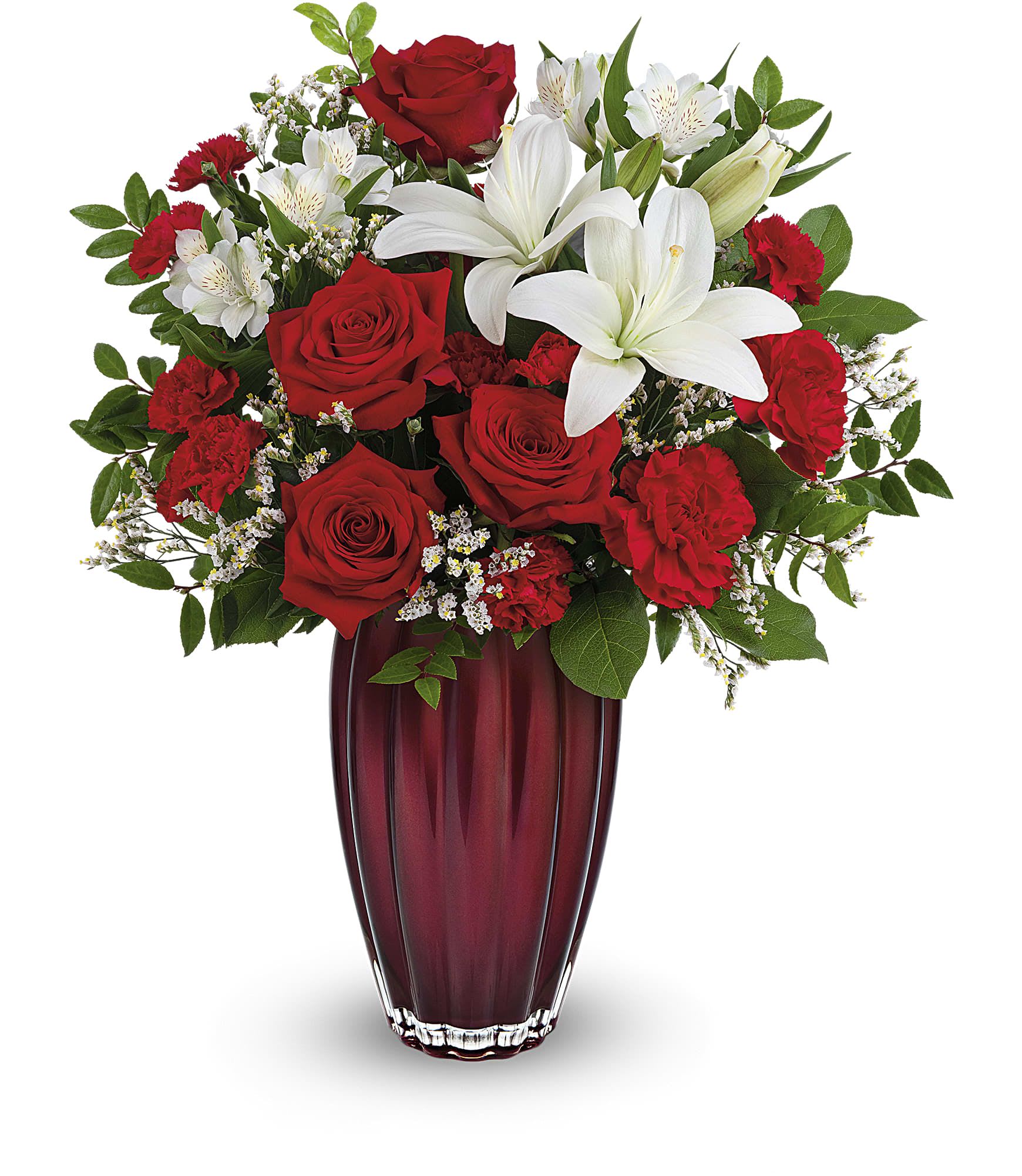 Red roses and white lilies arranged in a tall burgundy vase