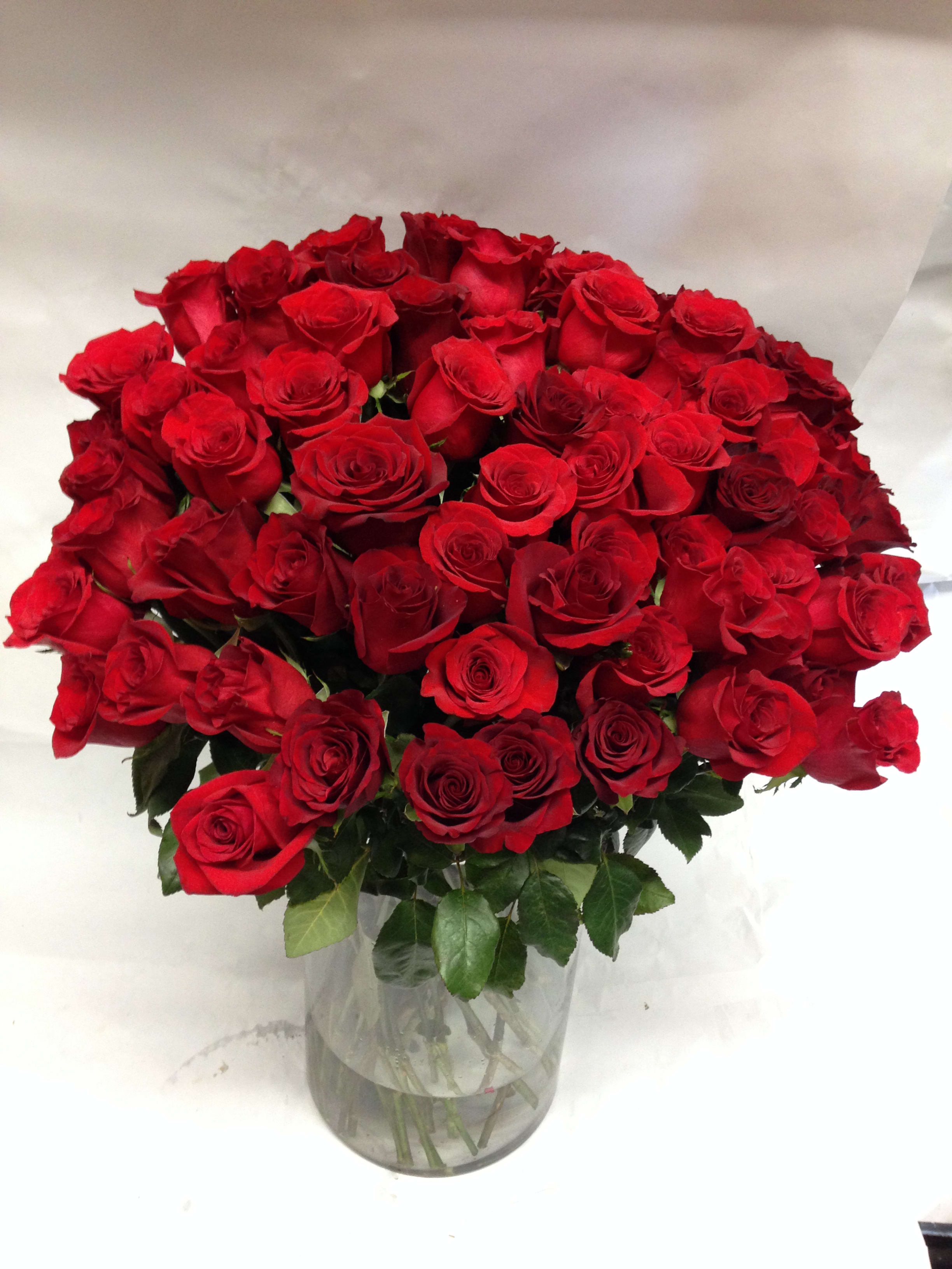 Bouquet of red roses in a clear glass vase
