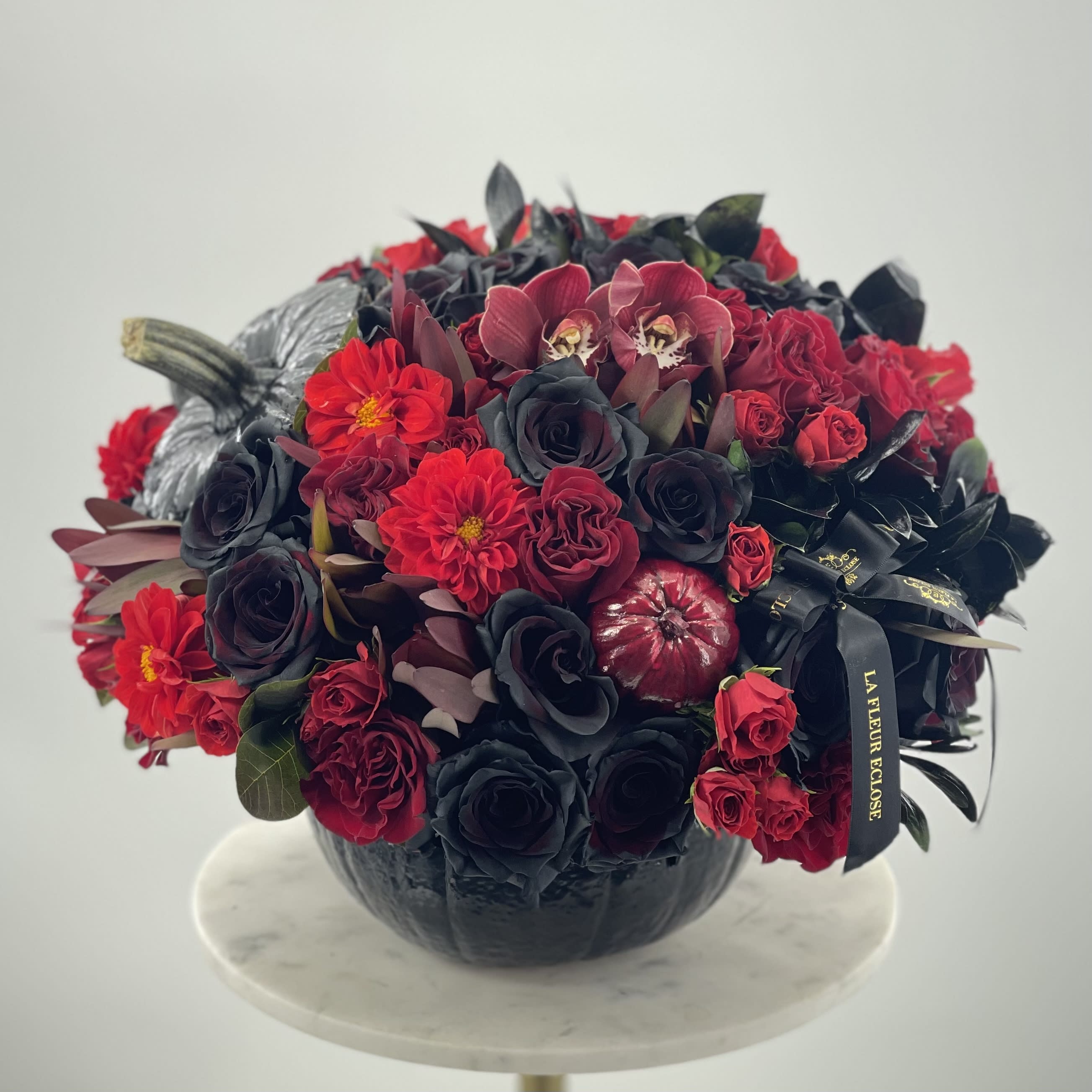 Bloody pumpkin  - Black pumpkin with a fresh flowers arrangement which includes black roses 