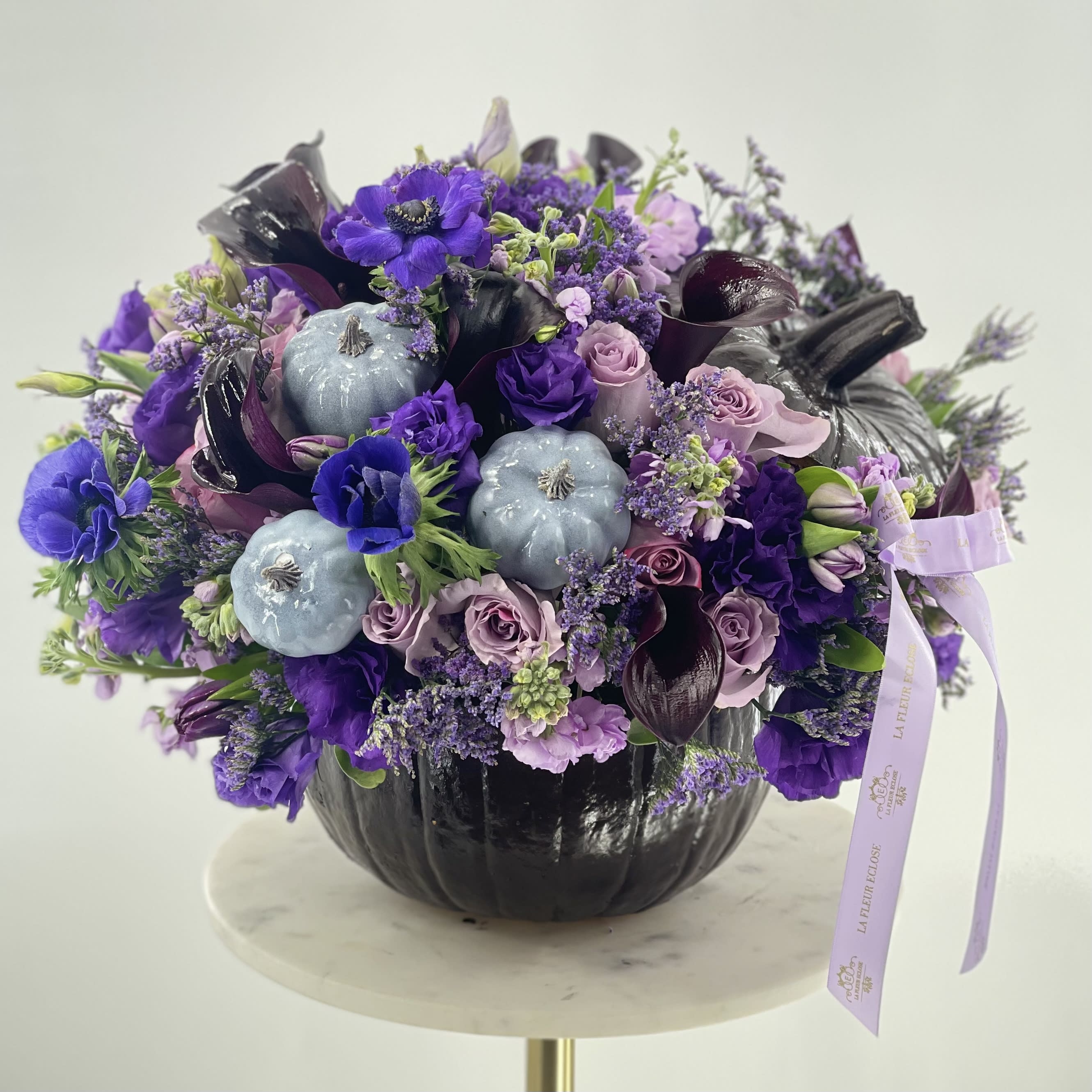 Purple rain - Beautiful dark brown pumpkin with the purple arrangement of fresh flowers!