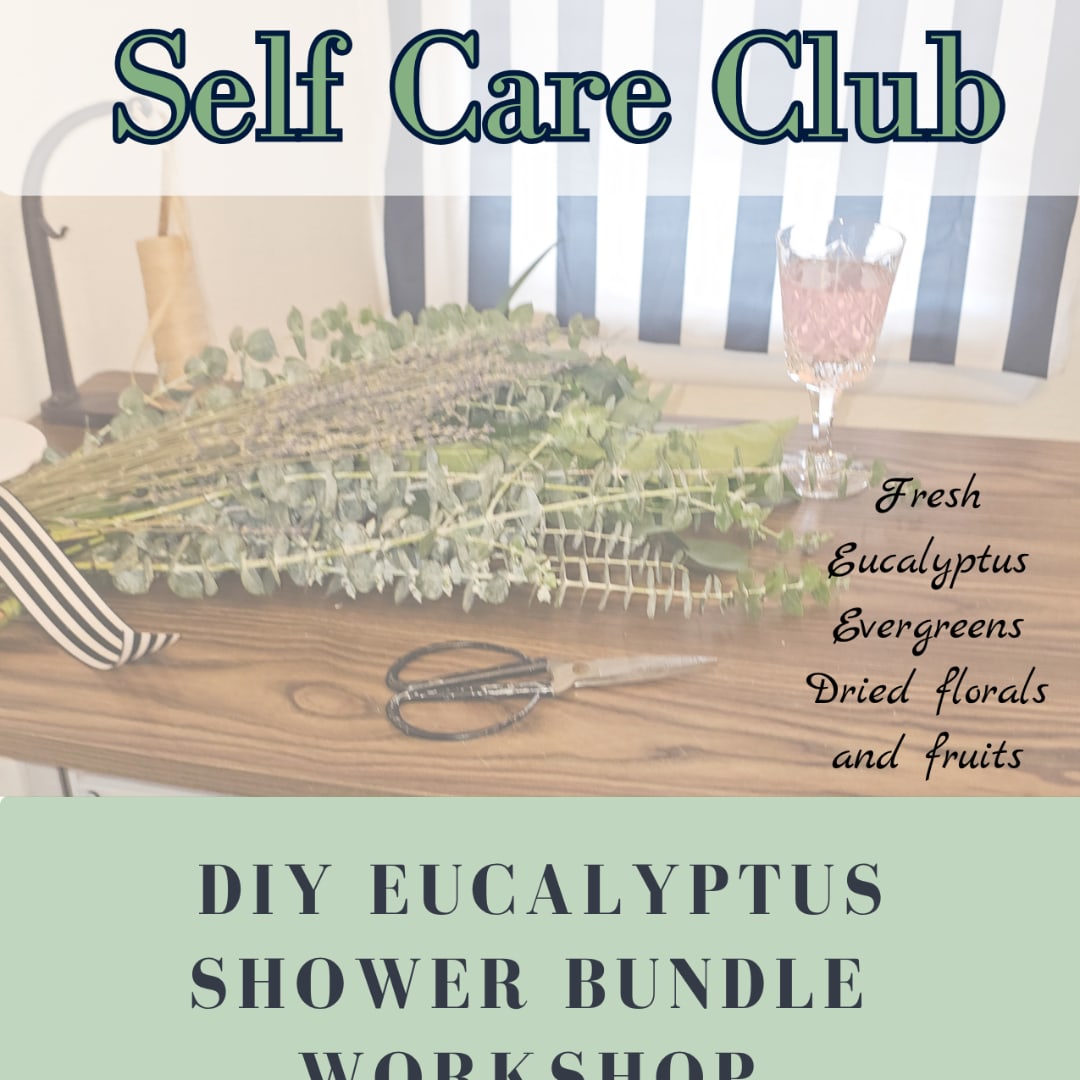 Bundle of eucalyptus and dried greenery on a wooden table with scissors