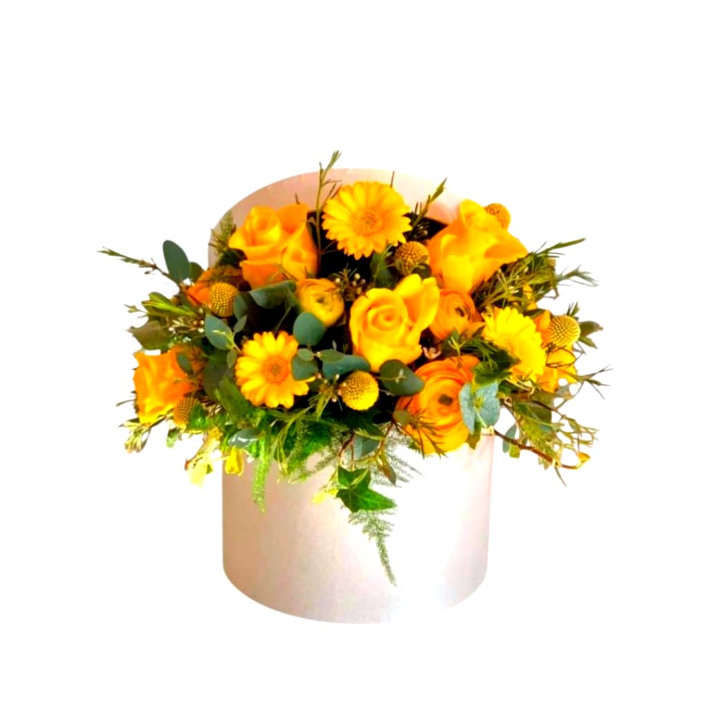 Yellow and orange bouquet in a white hatbox