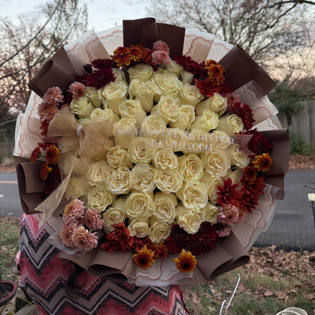 Large bouquet of cream roses with burgundy and pink mums