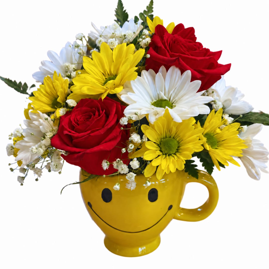 Red roses and yellow-white daisies in a yellow smiley-face mug