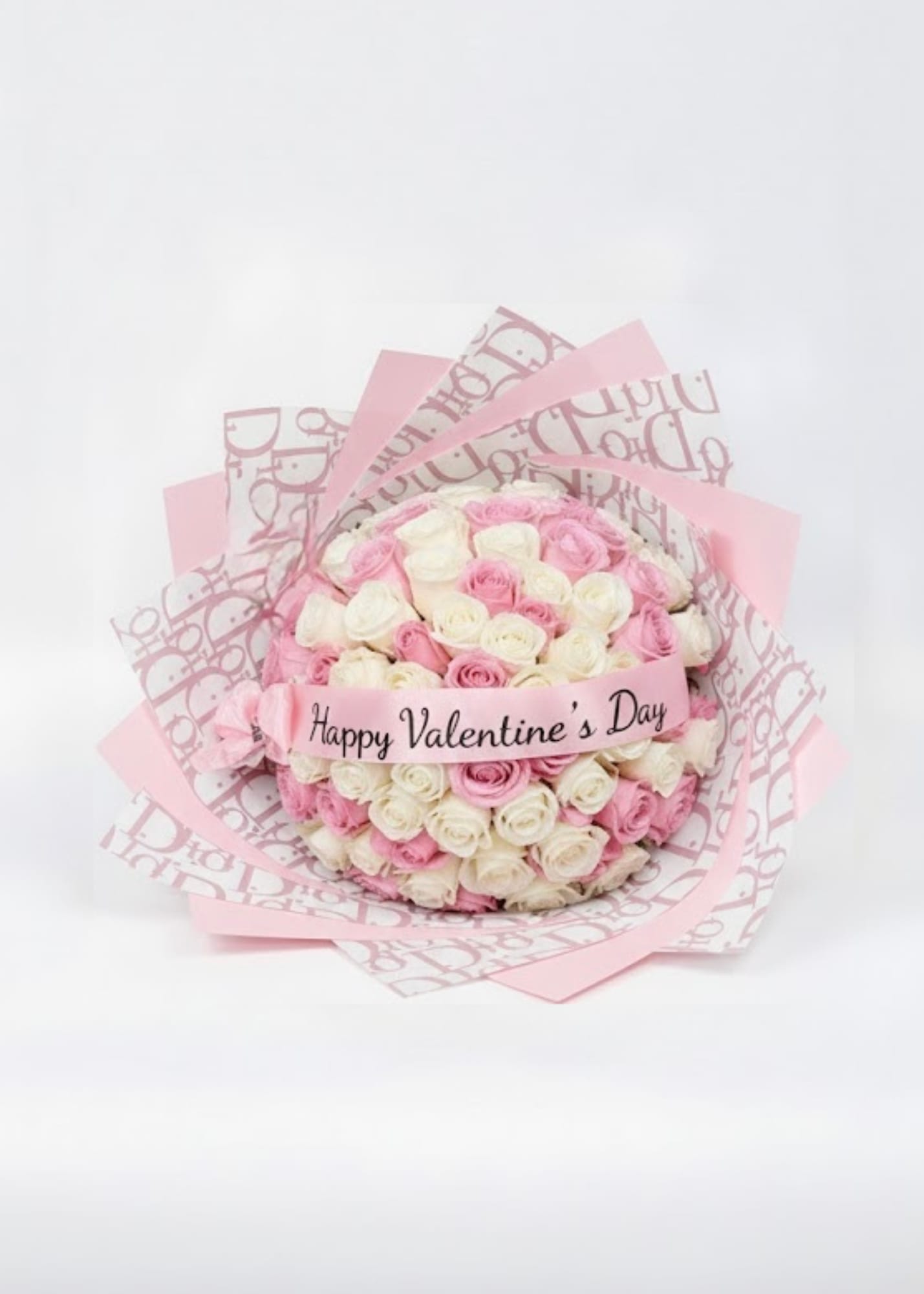 Pink and white rose bouquet with a Happy Valentine's Day ribbon