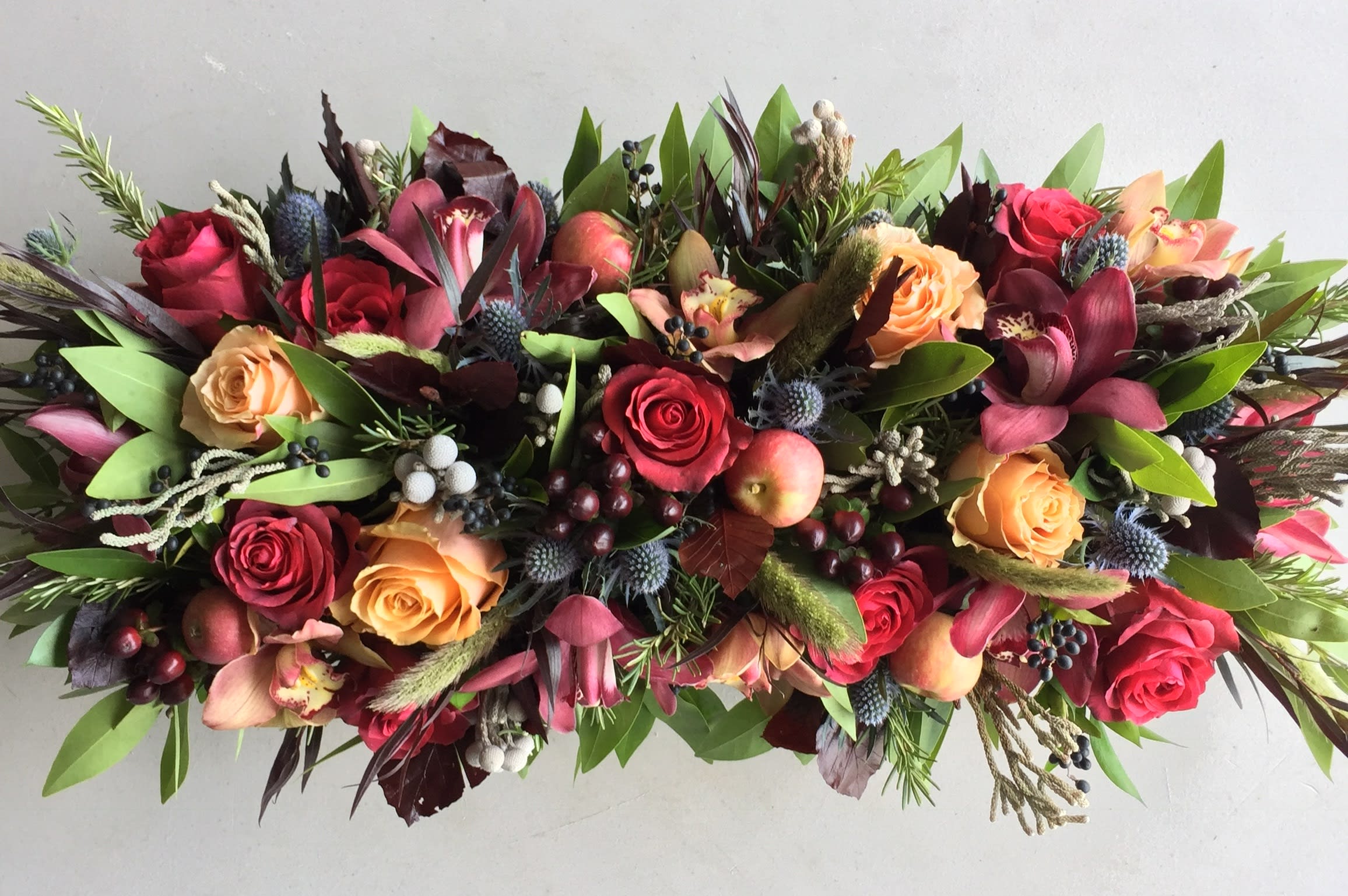 Holiday Table Centerpiece - Your Holiday Tablescape Awaits... Transform your holiday gathering into an unforgettable experience with blooms that tell your story. Whether you're hosting an intimate dinner or a festive feast, our handcrafted floral centerpieces set the tone for connection, comfort, and celebration.  Larger boxes/trays are available. Call for sizing and availability and your preferred color palette at  949-682-5004.