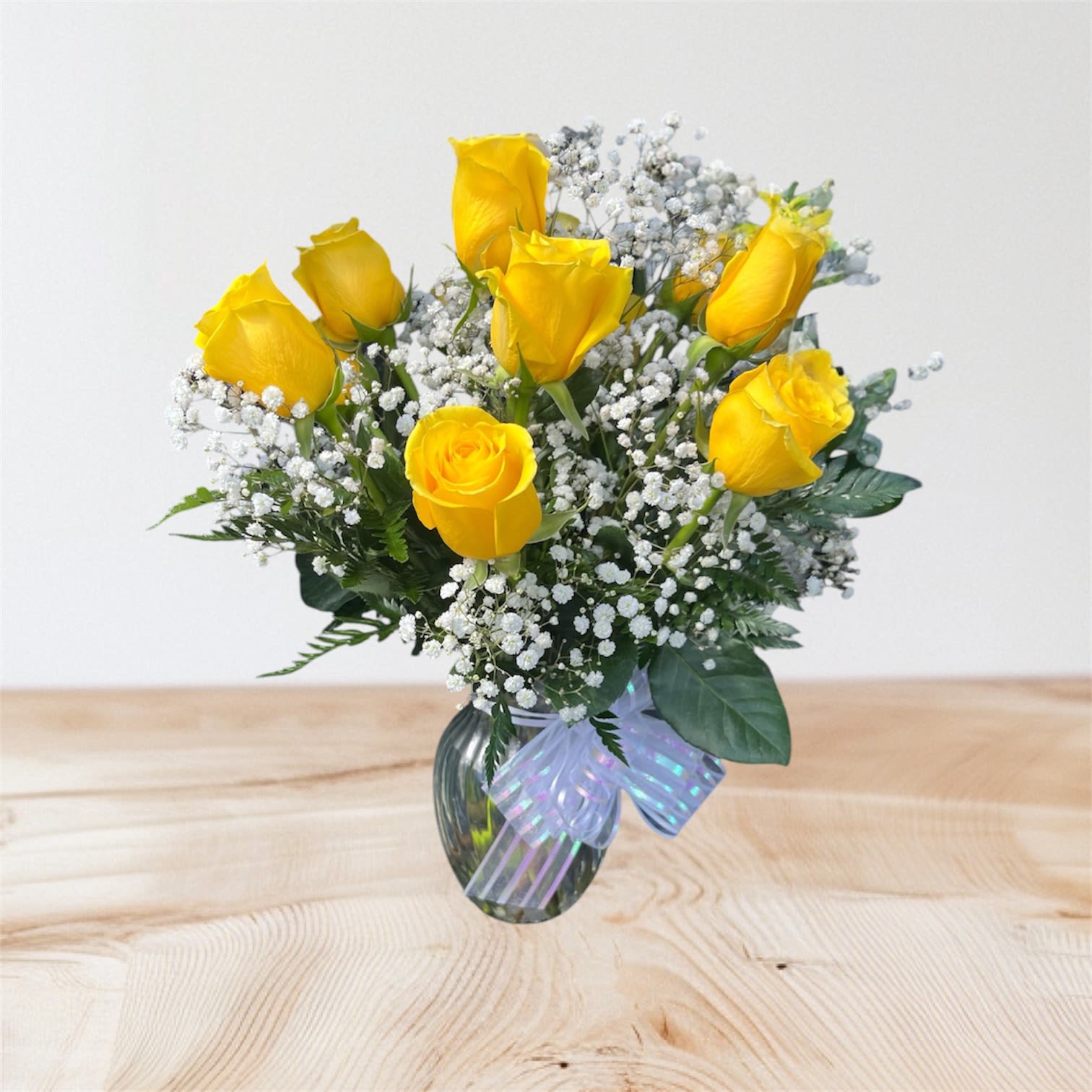 Felicitations by BloomNation™ - Yellow roses are a great option to send a non-romantic love. Send a dozen yellow roses to your friend or family member to brighten up their space and celebrate them! Yellow roses are a good gift for graduations, birthdays, or celebrating an accomplishment like a new job.  Approximate Dimensions: 18"D x 25"H