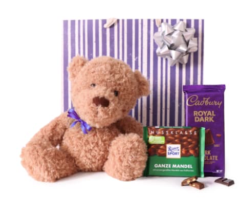 Teddy bear with chocolate bars and a gift bow