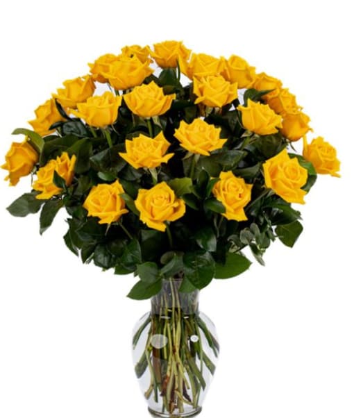 Bouquet of yellow roses in a clear glass vase