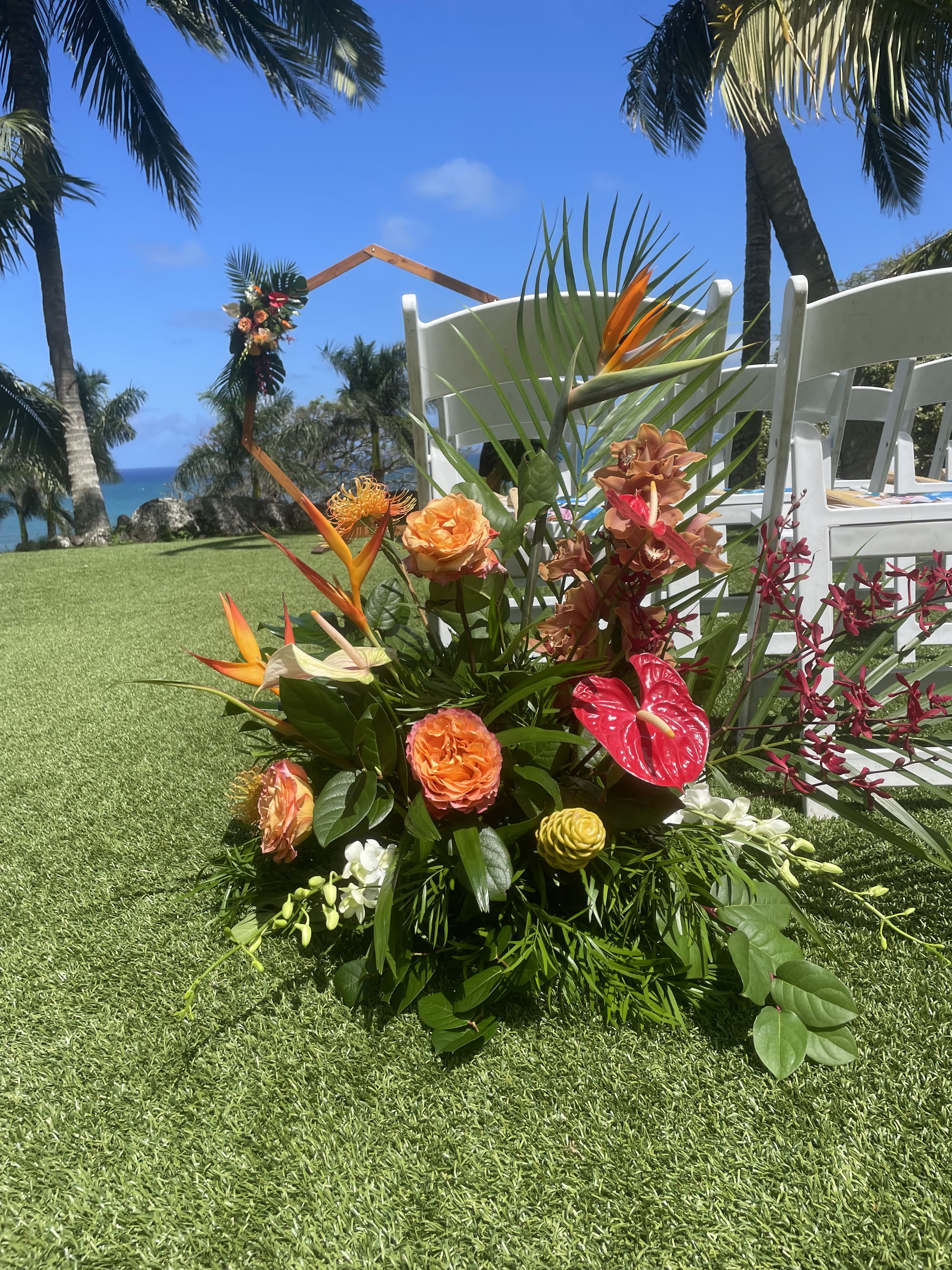 Bushel/Floor Arrangement for Ceremony - Aisleway bushels create a styled pathway that help frame the space, and provide a cohesive design element that can be repurposed after the ceremony for added value. 