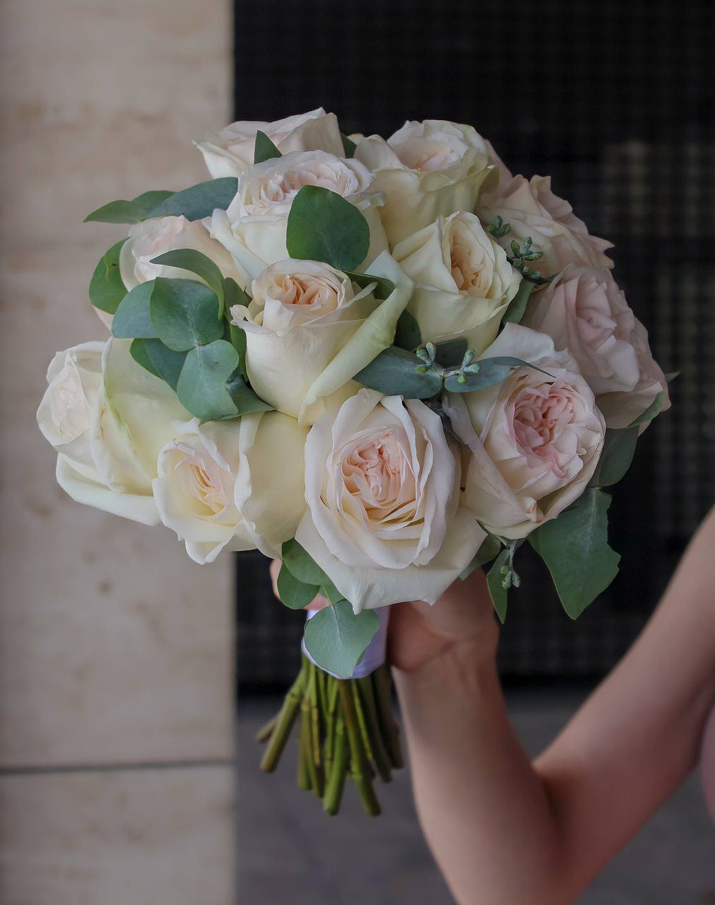 Bouquet of cream and blush roses with eucalyptus