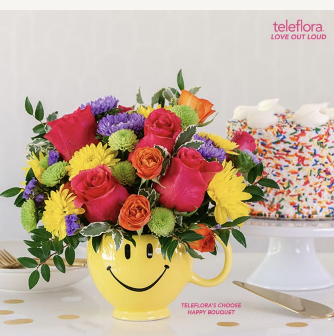 Bright mixed bouquet in a yellow smiley-face mug