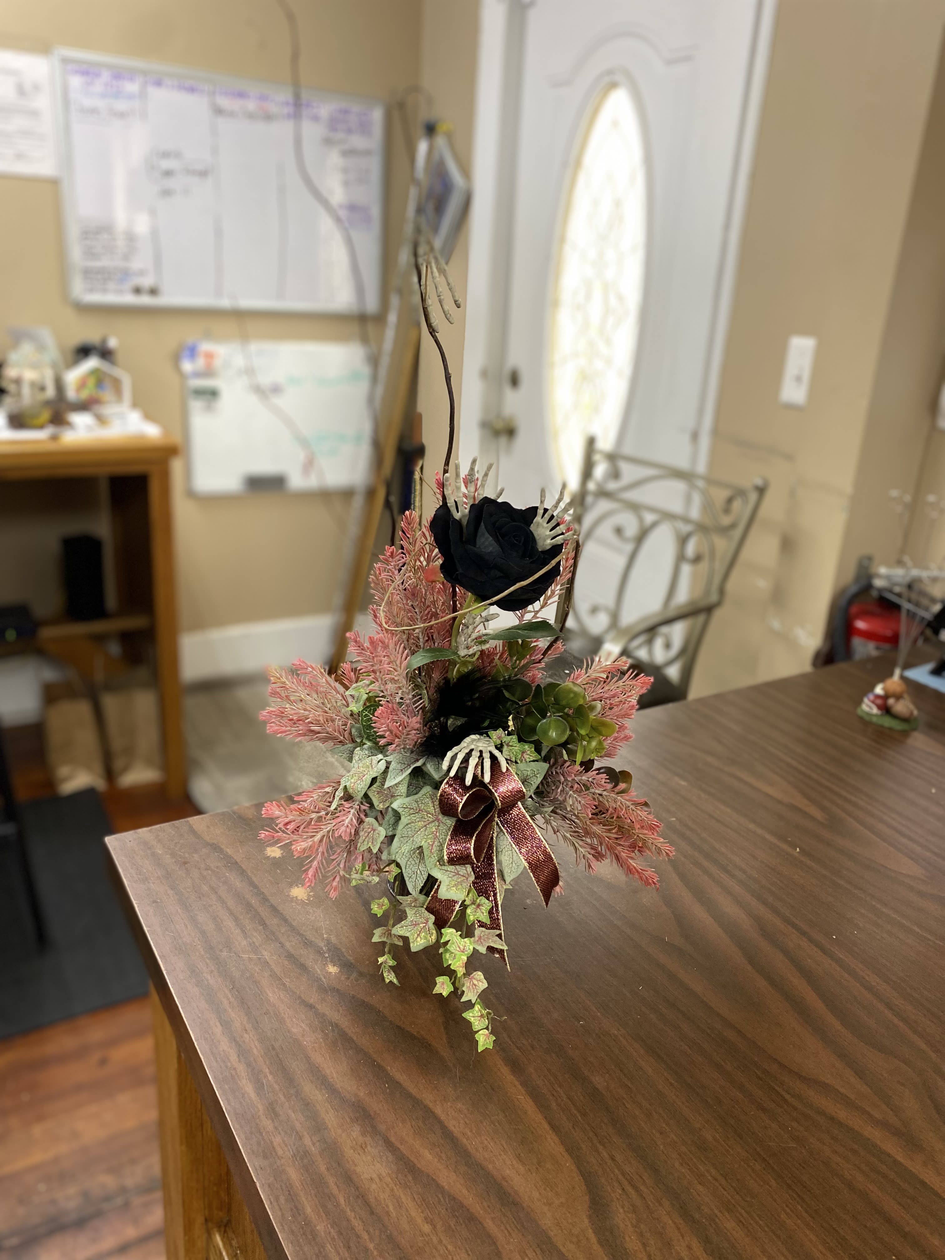 Silk Halloween Rose Vase - A bud vase filled with a silk black rose and filled with spooky touches.