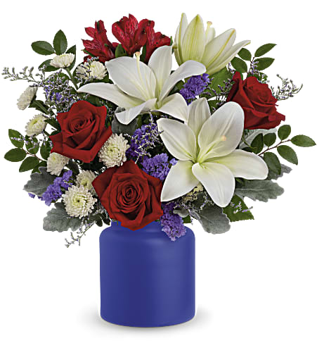 Red roses and white lilies in a blue vase