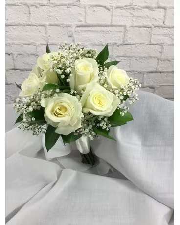 White rose bouquet with baby's breath and greenery