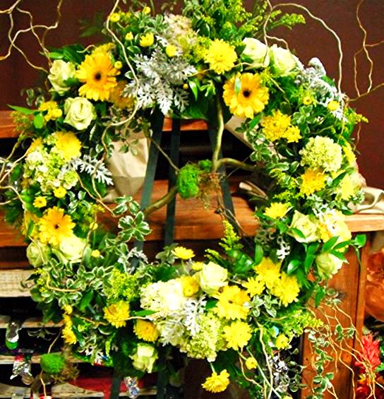Large floral wreath with yellow and white flowers