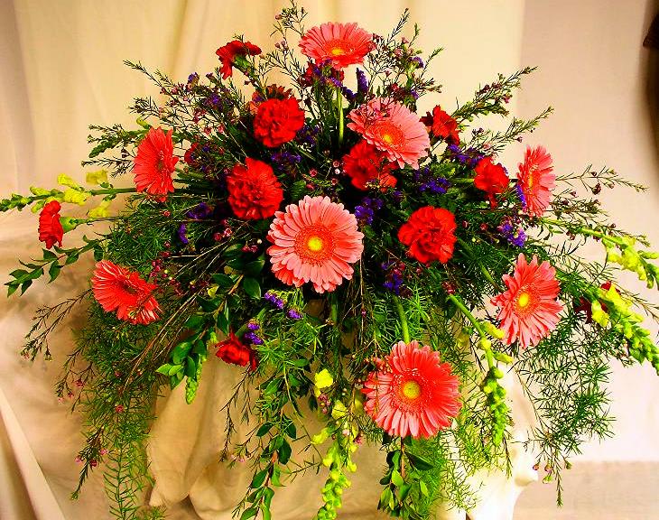Large bouquet of pink gerbera daisies and red carnations