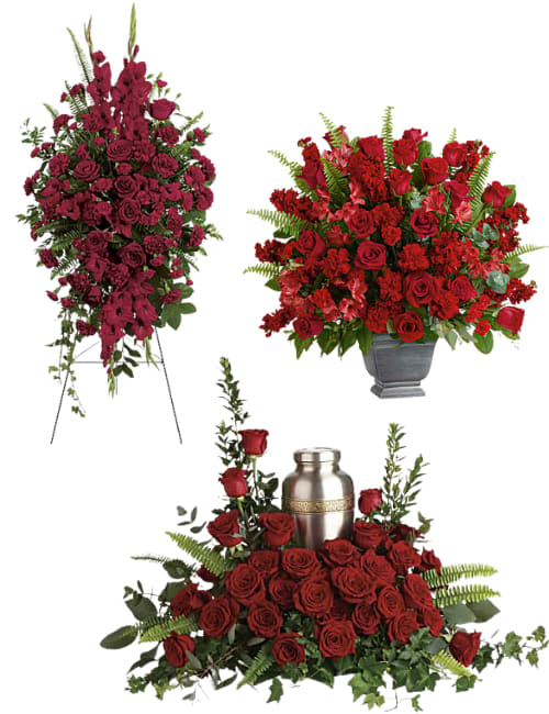 Crimson Love Collection - Crimson Tribute Collection  Honor a cherished life with the timeless beauty of the Crimson Tribute Collection. This coordinated sympathy set includes the Crimson Honor Tribute, Crimson Legacy Standing Spray, and Crimson Remembrance Tribute, each thoughtfully designed with rich red roses, carnations, premium seasonal blooms, and lush greenery. Together, these elegant arrangements create a beautiful and heartfelt display of love, respect, and remembrance, offering comfort to family and friends while celebrating a life well lived.  Collection includes:  Crimson Honor Tribute – Traditional sympathy arrangement in a keepsake urn-style container. Crimson Legacy Standing Spray – Elegant standing easel spray for funeral or memorial services. Crimson Remembrance Tribute – Cremation floral arrangement designed to surround a standard urn. Urn not included.