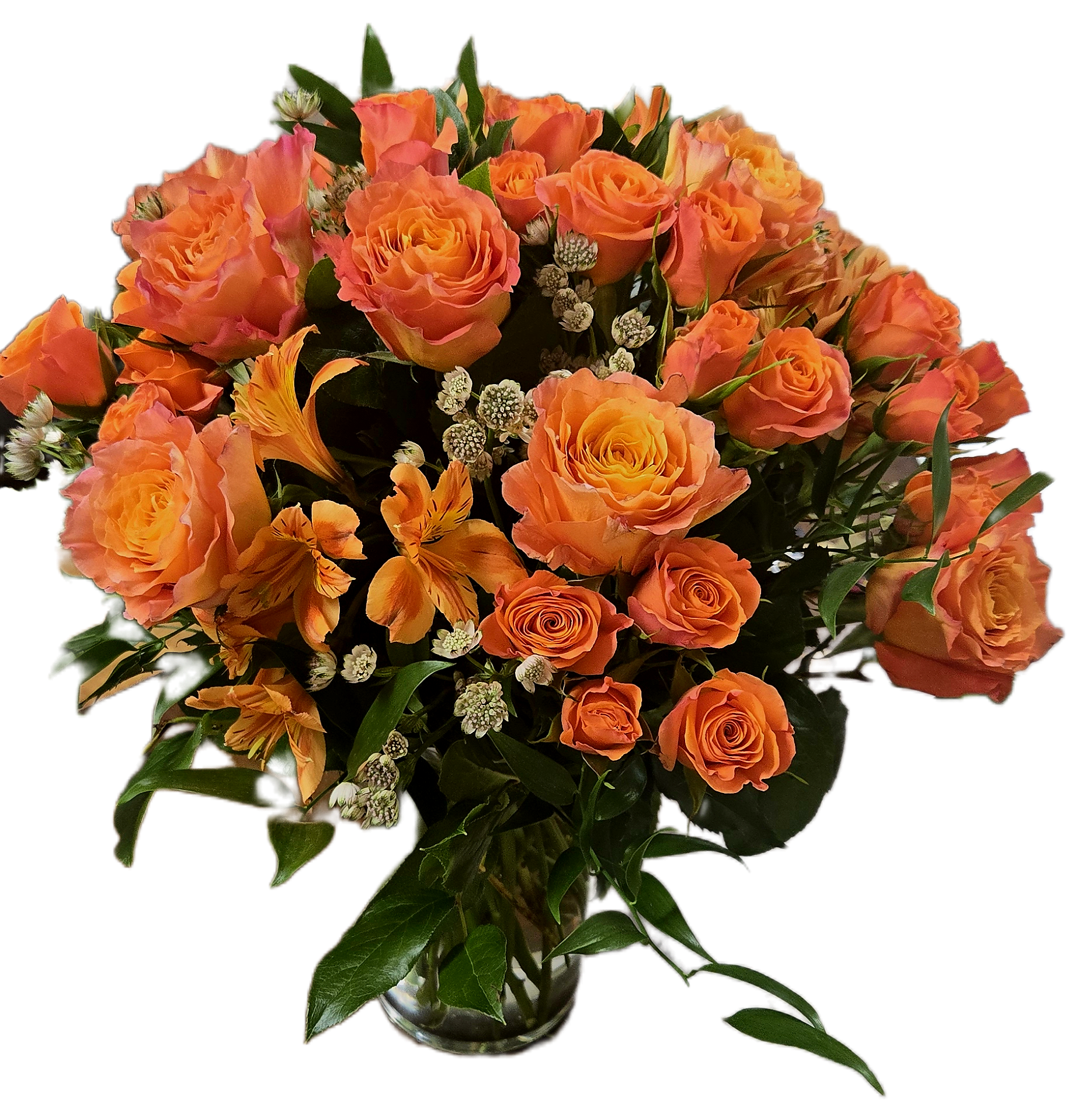 Free Spirit  - A lush arrangement of orange roses with complimentary blooms.