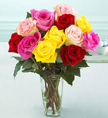 Bouquet of multicolored roses in a clear glass vase